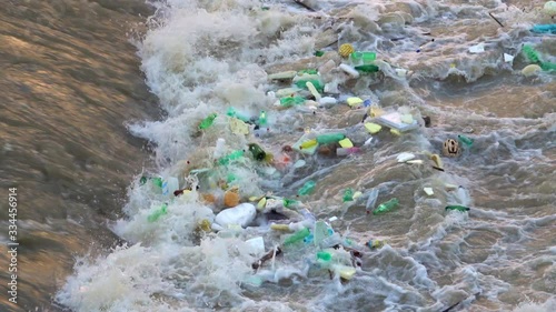 Plastic waste in the current of a river
