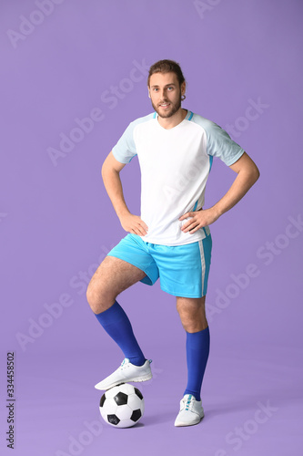 Male football player on color background © Pixel-Shot