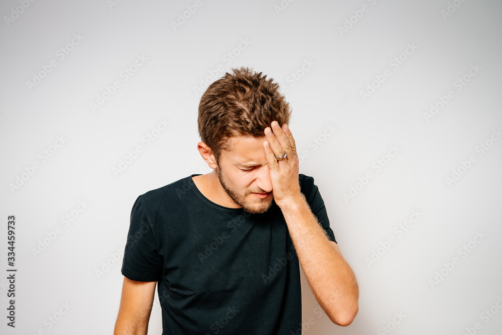 man covers his face by hand man covers his face by hand