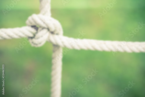 Abstract blur of knot rope from kid toy in park playground - Vintage filter