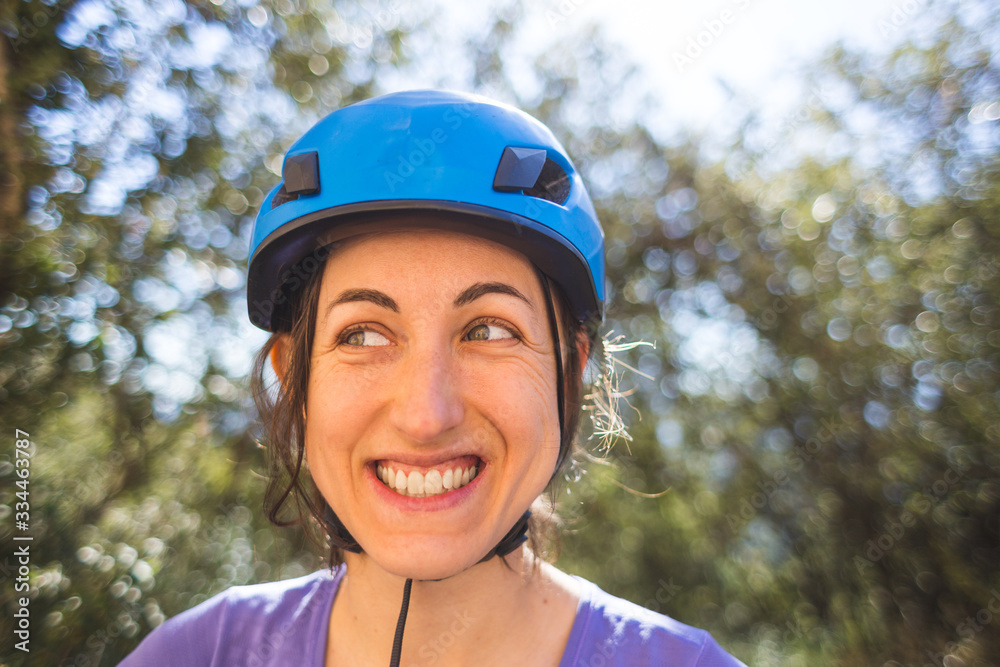Portrait of a woman in a blue safety helmet. Portrait of a woman in a blue safety helmet.