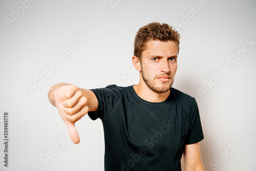 man showing a thumb down gesture