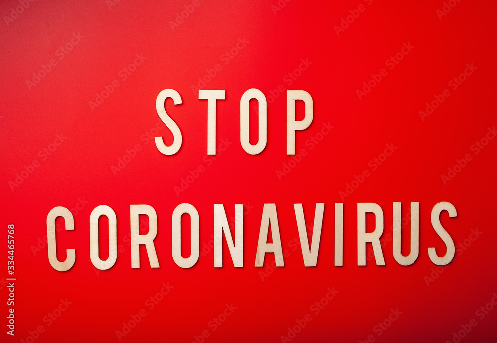 stop coronavirus word text wooden letter on red background corona virus covid-19 stop coronavirus word text wooden letter on red background corona virus covid-19