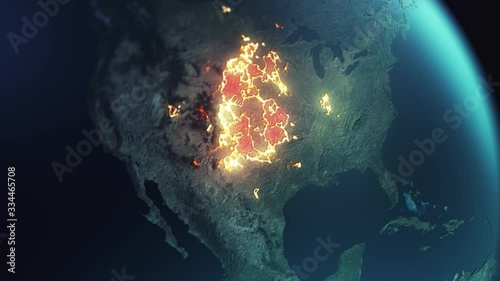 a shot from space for planet earth focusing on United States region and North America continent as we see a plague. infection or corona virus spreading across the land visualized in a fire effect photo