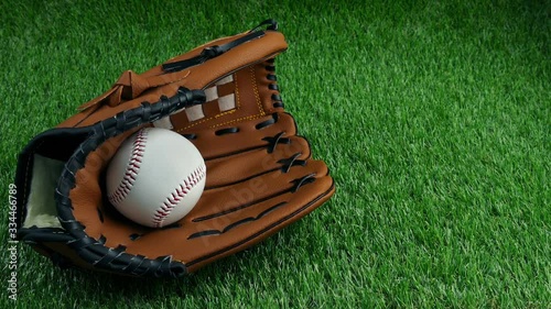 Baseball Catcher's Mitt And Ball On The Pitch photo