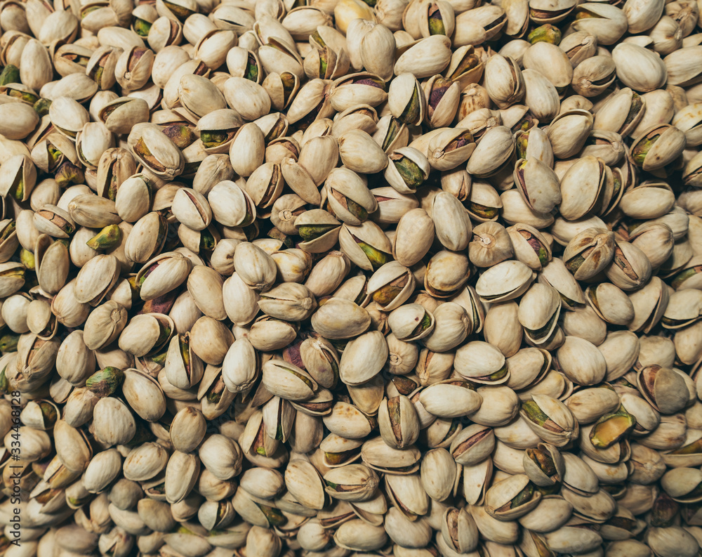 In shell pistachios nuts closeup texture photo. In shell pistachios nuts closeup texture photo.