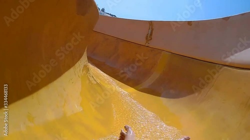 Water Slide Ridding in a swimming pool - Andando escorrega de água na piscina photo