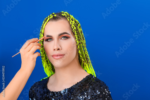 Artist applying makeup onto...