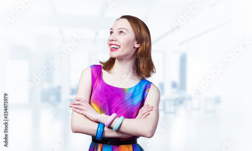 Free Download Smiling woman standing with folded arms - GFXLoad