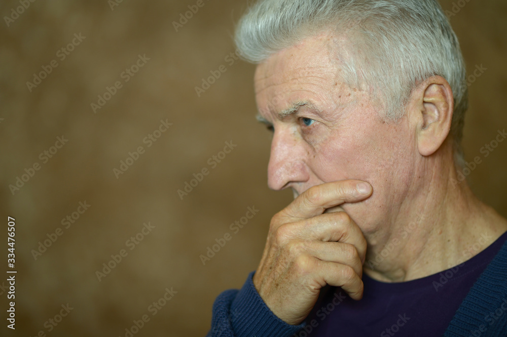 Portrait of thoughtful senior man at home Portrait of thoughtful senior man at home