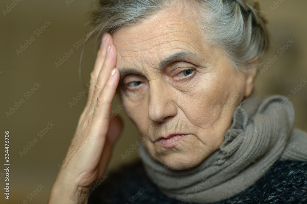 Portrait of sad ill senior woman with headache Portrait of sad ill senior woman with headache