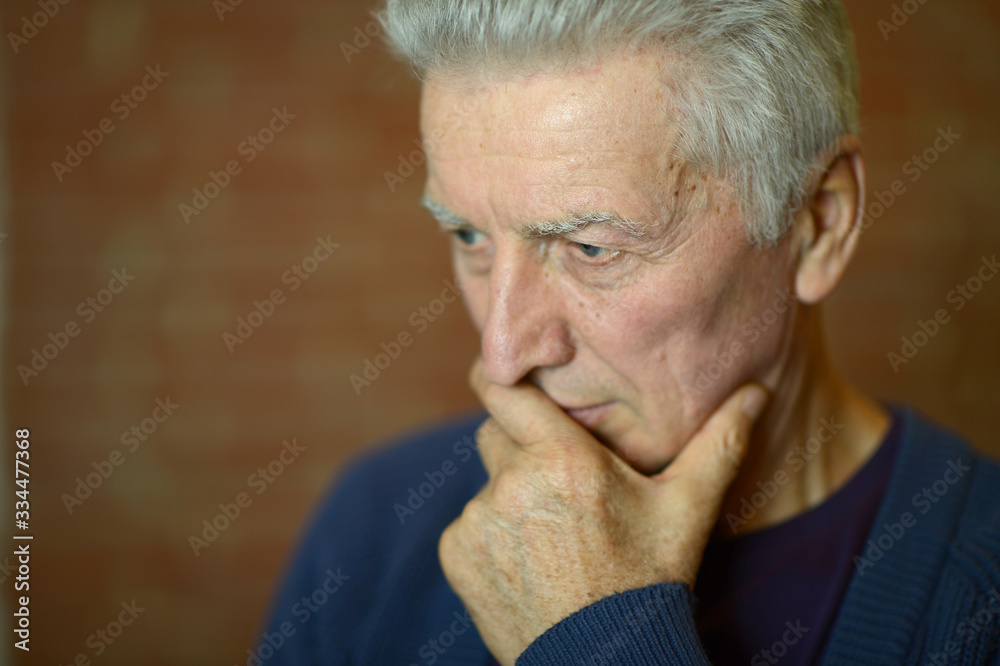 Portrait of thoughtful senior man at home Portrait of thoughtful senior man at home