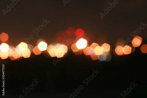 Red and orange Bokeh pentagon for background, glitter light Defocused and Blurred Bokeh, Colorful.