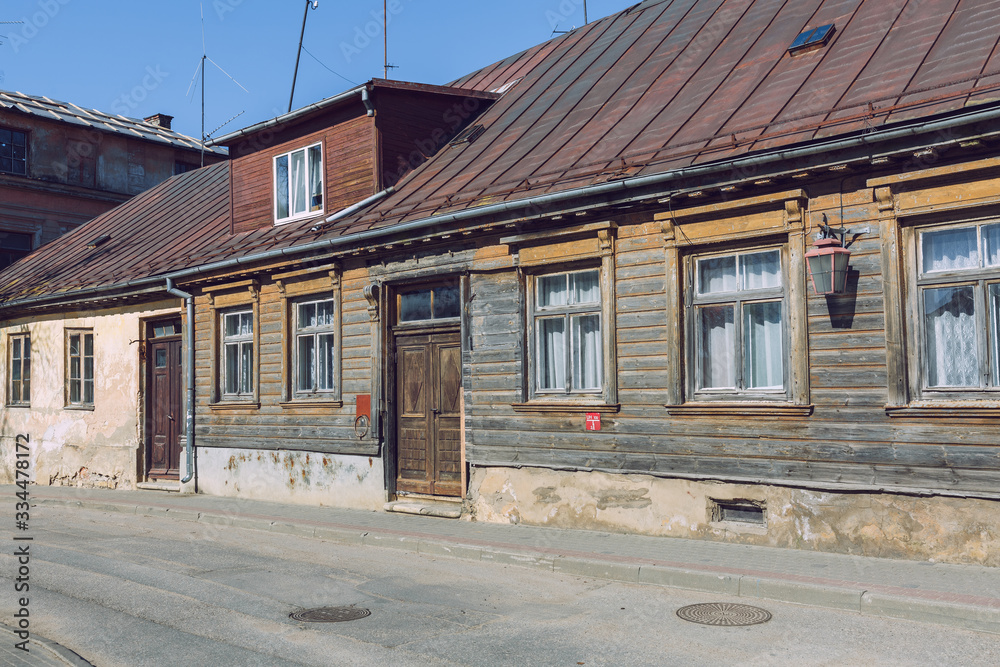 City Cesis, Latvia. Street with old wooden house and buildings.