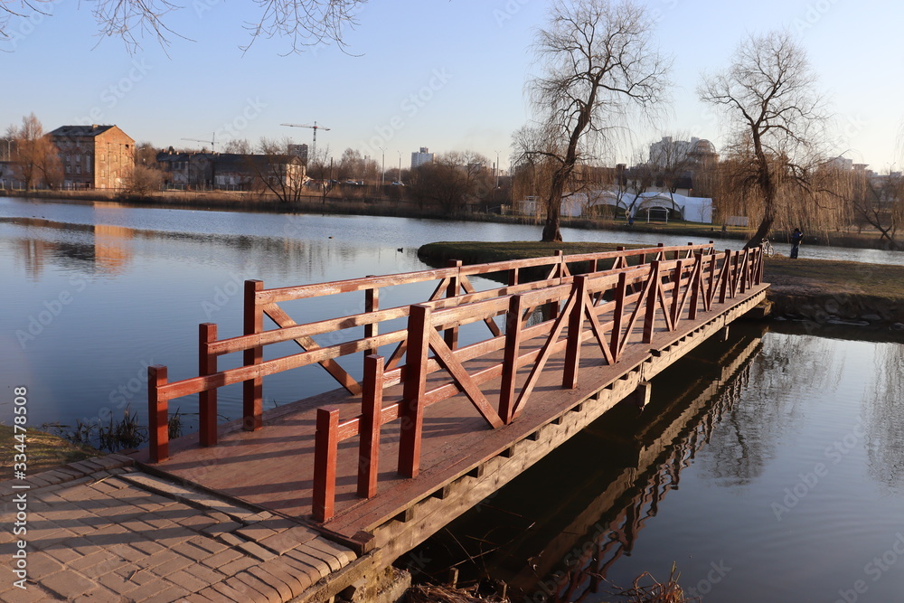 wooden lake pier in spring park