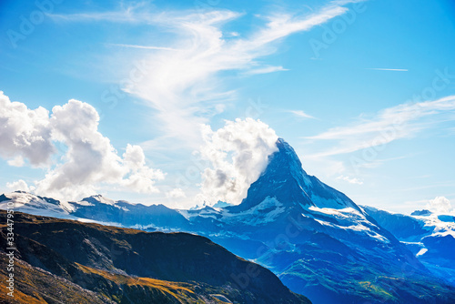 Obraz na płótnie Fascinating landscape with with the top of the mountain Matterhorn in the clouds in the Swiss Alps, near Zermatt, Switzerland w salonie