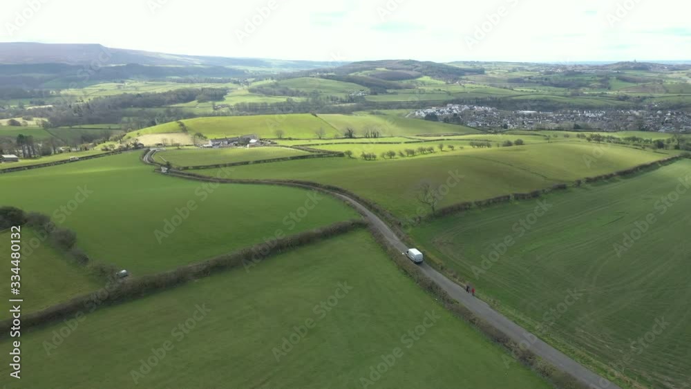 4K: Courier Delivery Van driving through the rural countryside - Aerial Drone Shot. Stock Video Clip Footage 4K: Courier Delivery Van driving through the rural countryside - Aerial Drone Shot. Stock Video Clip Footage