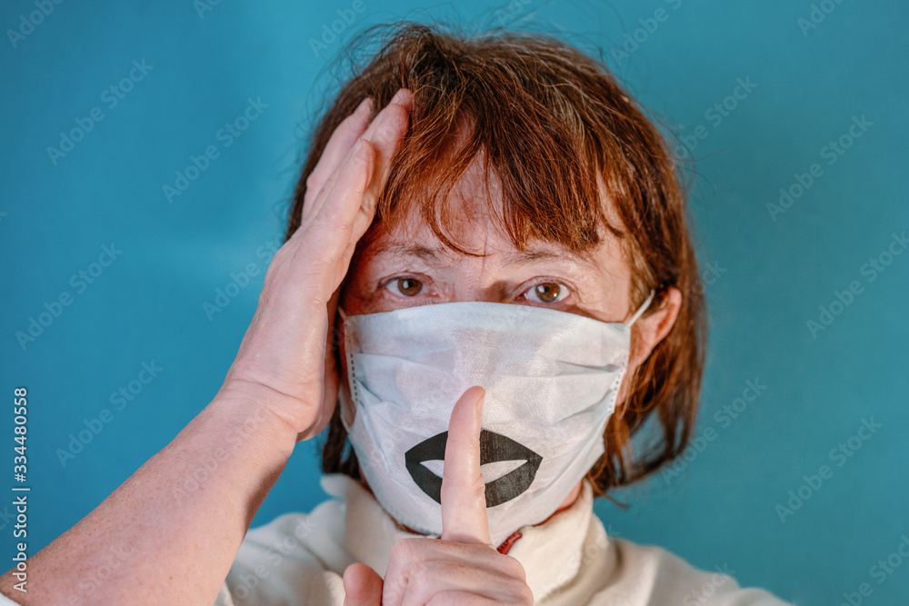 Woman in white medical face mask with black lips. Concept of coronavirus quarantine. Novel coronavirus (2019-nCoV) Woman in white medical face mask with black lips. Concept of coronavirus quarantine. Novel coronavirus (2019-nCoV)