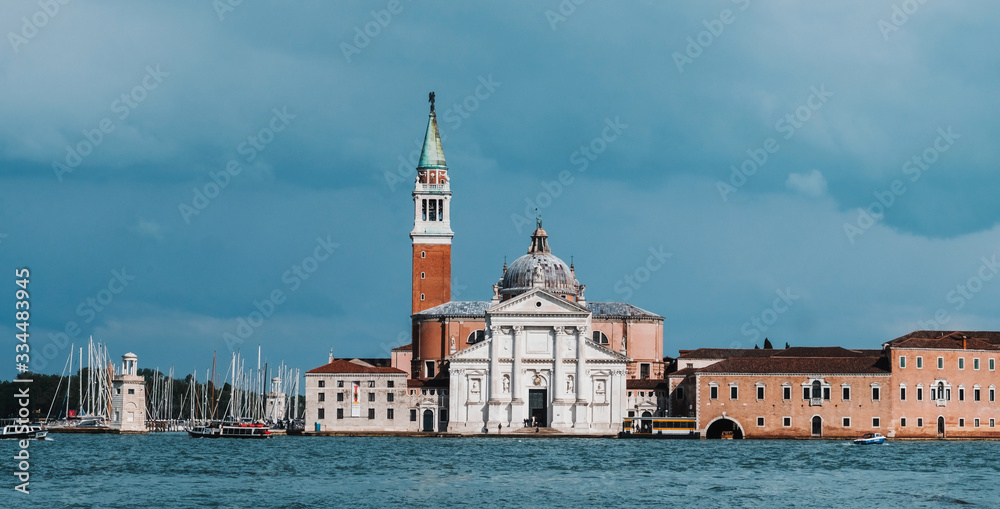 View to San Giorgio island in Venice, Italy. Opposite view. San Giorgio Maggiore Church and tower behond. Beautiful blue and lagoon colors.