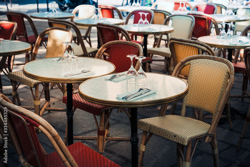 Street view of a coffee terrace with tables and chairs, Paris, France Street view of a coffee terrace with tables and chairs, Paris, France