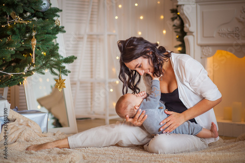 mother hug newborn son lights