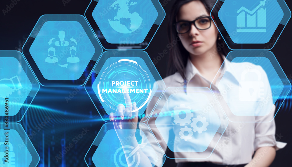 Business, Technology, Internet and network concept. Young businessman working on a virtual screen of the future and sees the inscription: Project management Business, Technology, Internet and network concept. Young businessman working on a virtual screen of the future and sees the inscription: Project management