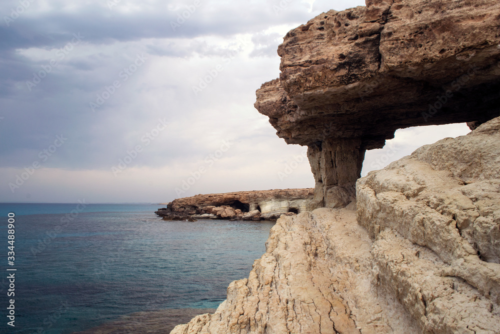 Picturesque rock with an arch on the seashore of Cape Greco in Cyprus.
