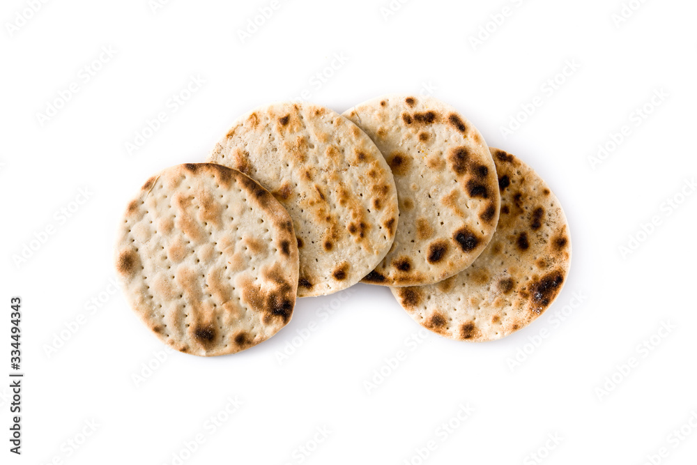 Handmade matzah for Jewish Passover isolated on white background. Top view Handmade matzah for Jewish Passover isolated on white background. Top view