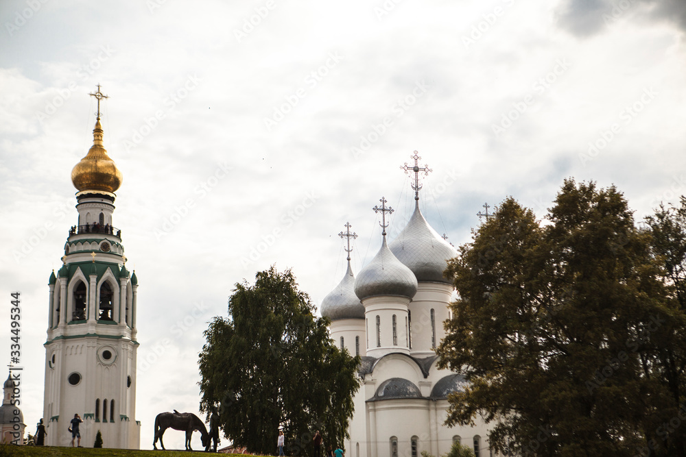 Russian Christian church, a temple on a background of gray sky and clouds.