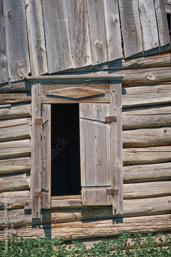 Old wooden window on abandoned house