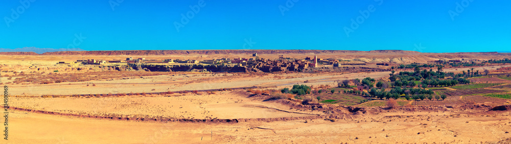 Panoramic view of small Berber settlement in savannah. Douar Itelouane, Ait BenHaddou valley, Morocco