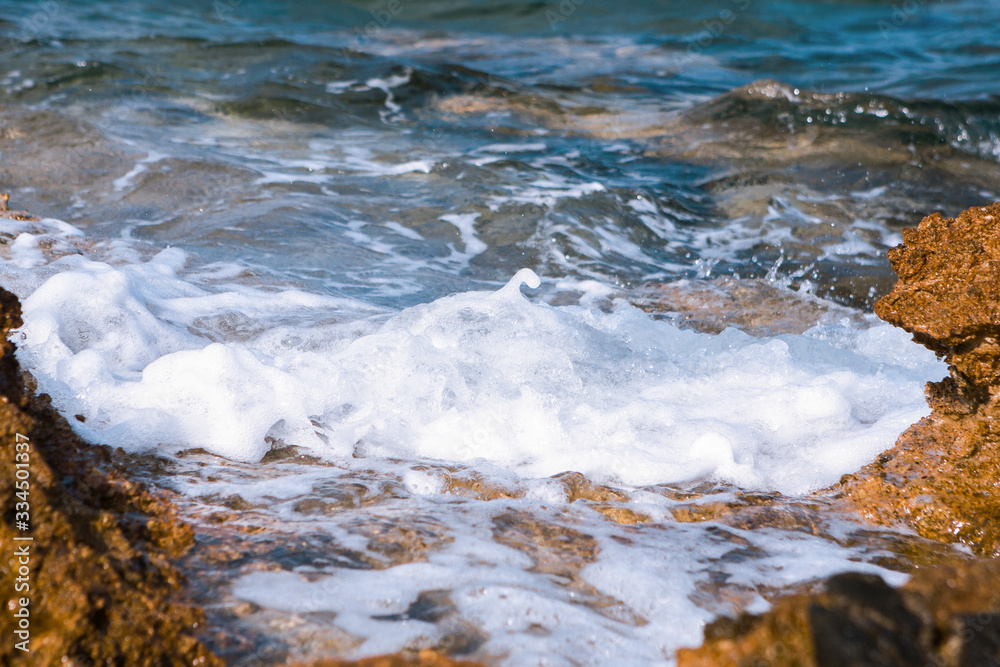 Peaceful wave slaps the seashore. Sea wave