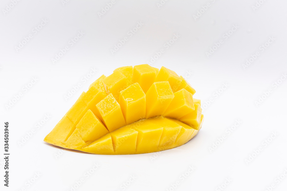 Yellow mango slice with cubes isolated white background Yellow mango slice with cubes isolated white background