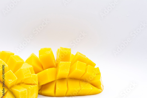 Yellow  mango slice with cubes isolated white background