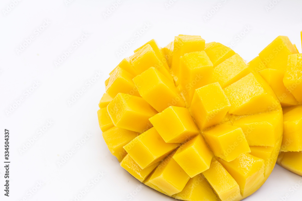 Yellow mango slice with cubes isolated white background Yellow mango slice with cubes isolated white background