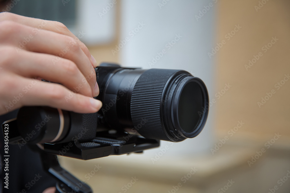 Focus on tripod mounted camera screen showing . Digital equipment recording video . Close up successful man recording video, using digital . Blogger recording vlog video on camera birthday.