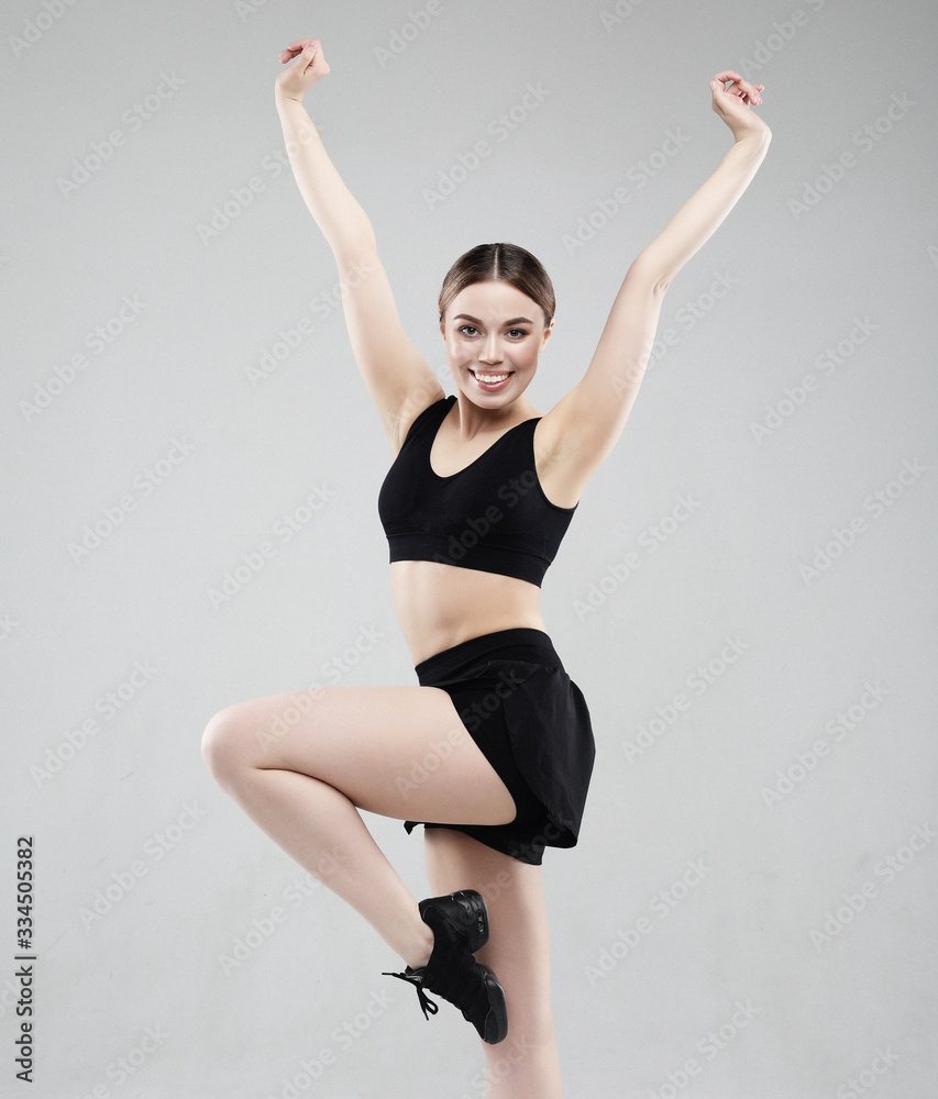 lovely young woman in sportswear jumping on a white background, sport concept lovely young woman in sportswear jumping on a white background, sport concept