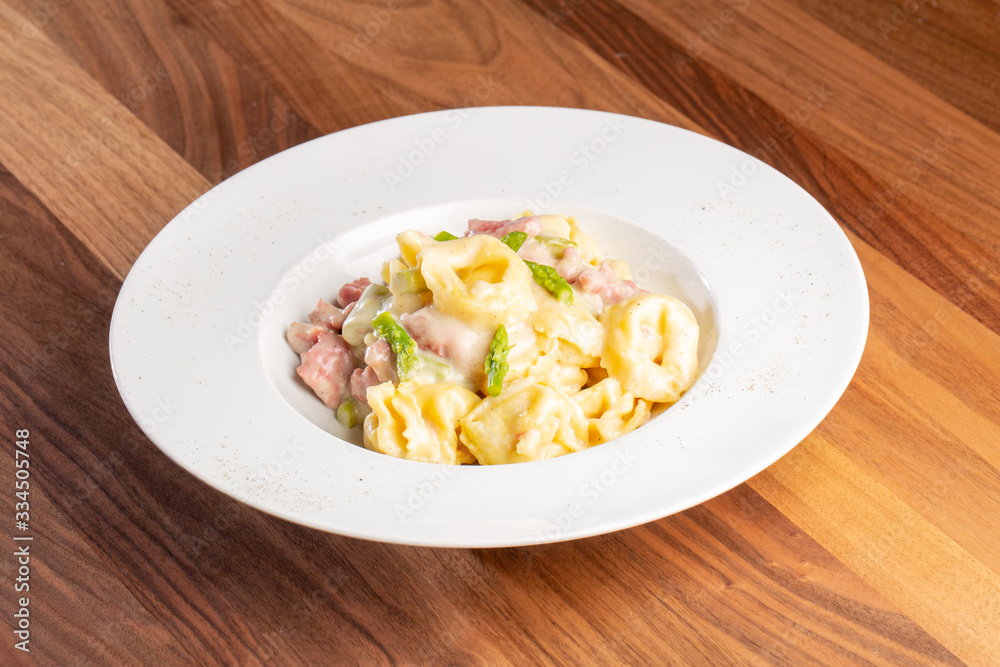 details of fresh hot tortellini with meat and sauce details of fresh hot tortellini with meat and sauce