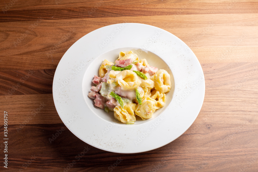 details of fresh hot tortellini with meat and sauce details of fresh hot tortellini with meat and sauce