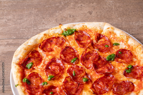 details of tasty fresh baked pesto spicy pizza