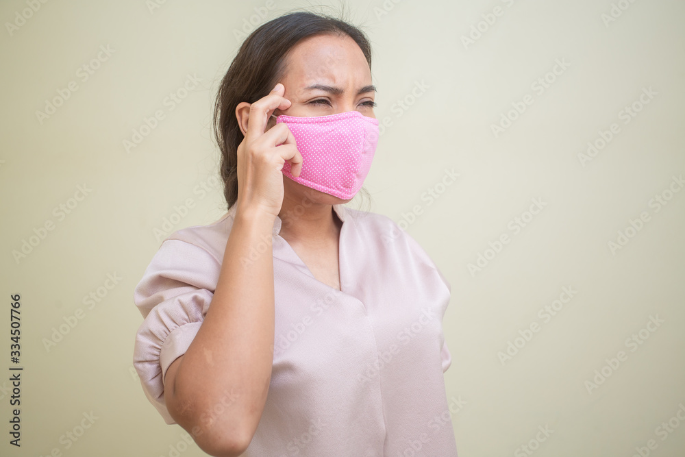 Women concerned about the Covid-19 virus And her mask Women concerned about the Covid-19 virus And her mask