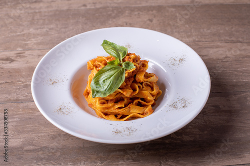 close up of tasty fresh pasta with bolognese sauce