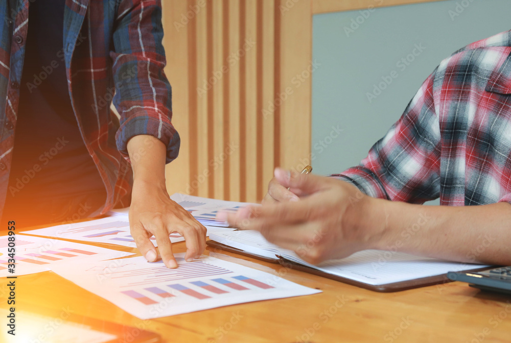 Team Businessmen are meeting for calculating and analyzing performance statistics for future investments.coordinate concept. Team Businessmen are meeting for calculating and analyzing performance statistics for future investments.coordinate concept.
