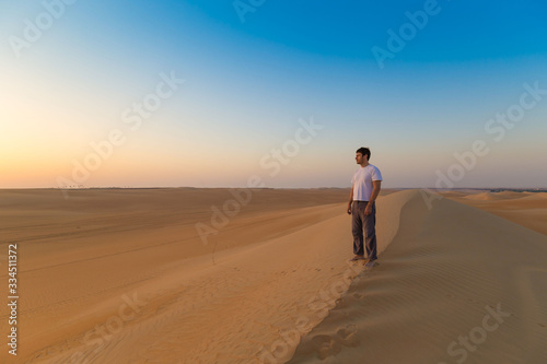 UAE. Man in desert © erainbow