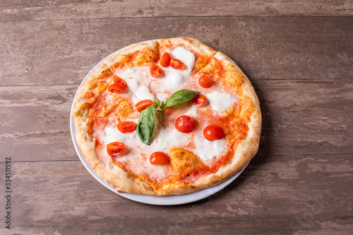 close up of delicious tomato and cheese italian classic pizza