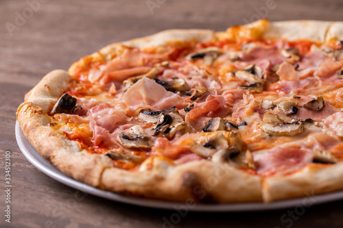 details of tasty ham and mushrooms pizza