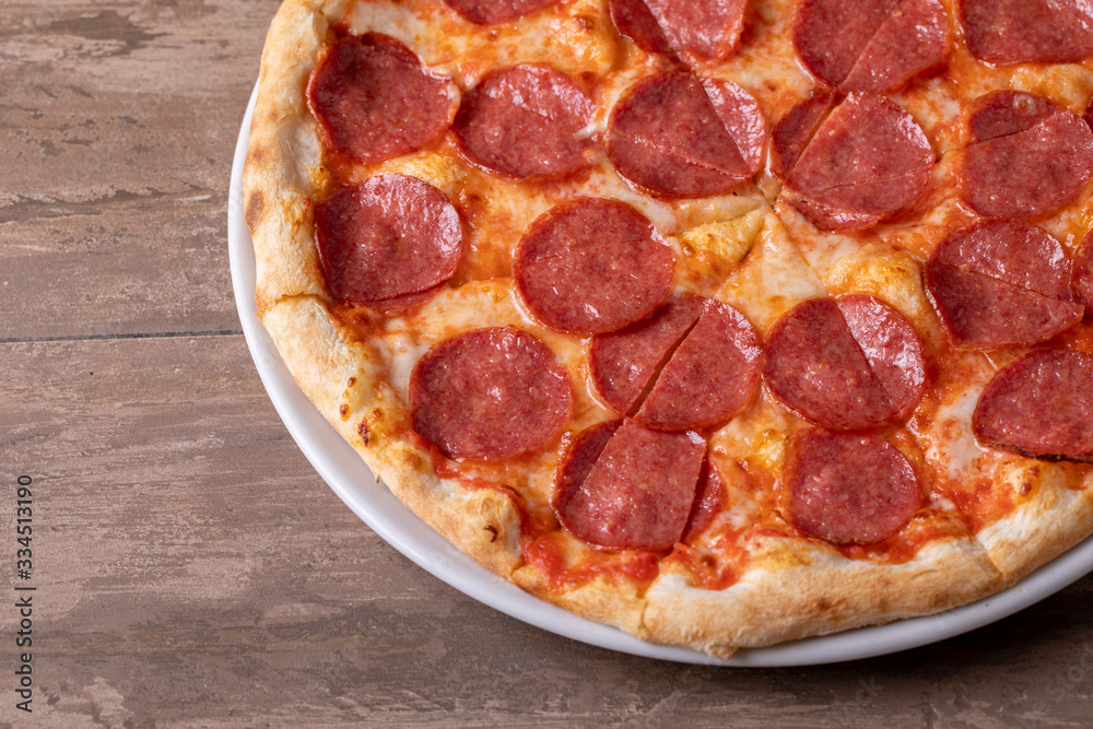 close up of tasty fresh baked salami pizza close up of tasty fresh baked salami pizza
