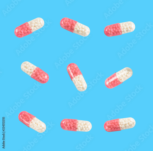 medical capsules on a clear blue background