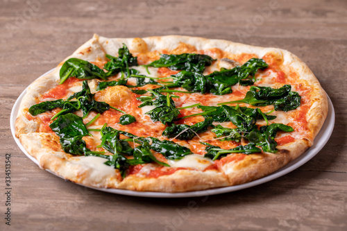 details of fresh tasty spinach pizza