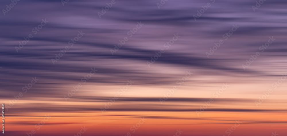 Wide beautiful blurred sunset orange, blue, purple gradient background